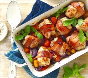 Bacon wrapped chicken thigh tray bake