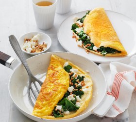 Fluffy Omelettes with Wilted Kale, Goat's Cheese and Pine Nuts
