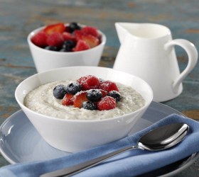 Creamy Porridge With Strawberries, Blueberries And Raspberries