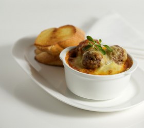 Herbed Pork Meatballs with Cheesy Topping