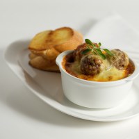 Herbed Pork Meatballs with Cheesy Topping