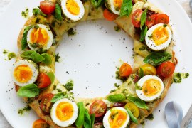 Herbed ricotta pastry wreath with pesto eggs