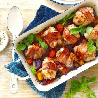 Bacon wrapped chicken thigh tray bake