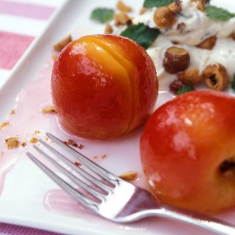 White Poached Nectarines with Sweetened Mint Cream and Toasted Hazelnuts