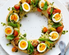 Herbed ricotta pastry wreath with pesto eggs