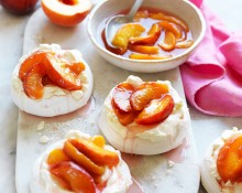 Mini pavlovas with poached peaches