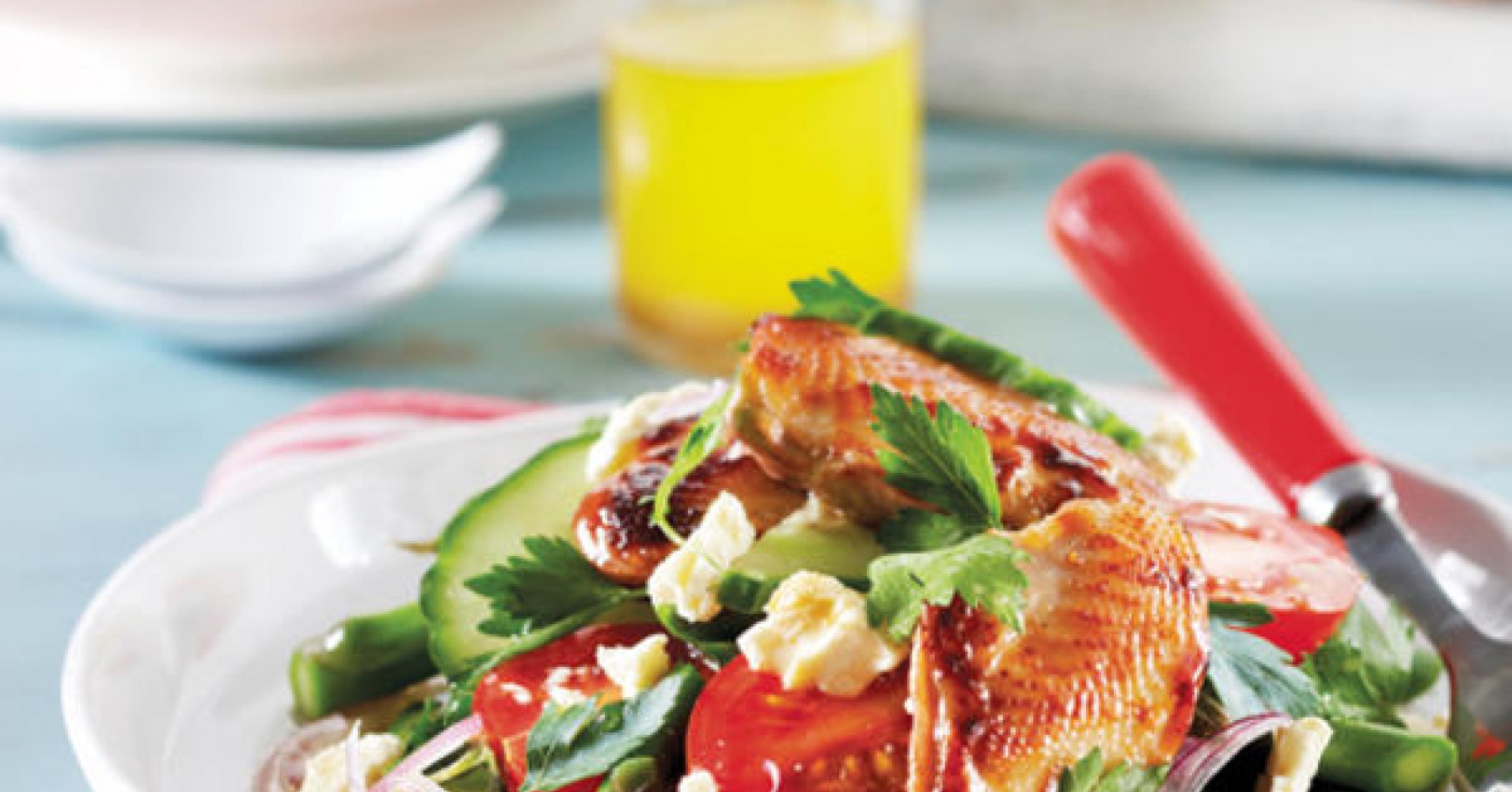 Orange Caramelised Breast of Quail with Salad of Cherry Tomatoes Cucumber Fetta Spanish Onion and Pa