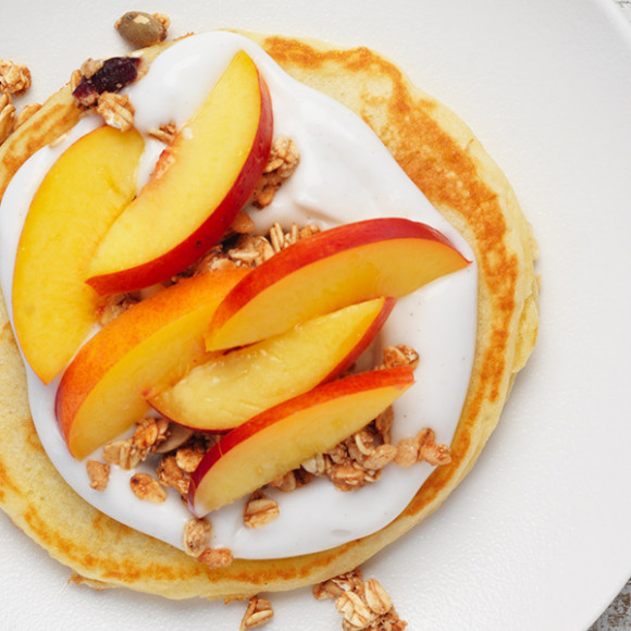 Easy pancake recipe with healthy topping idea of coconut yoghurt, granola and nectarine