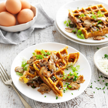 Low carb waffle with mushrooms and fresh herbs and eggs