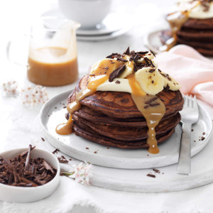 Double chocolate pancakes with chocolate chips and peanut butter sauce