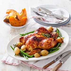 Maple Glazed Roast Chicken with potatoes and thyme