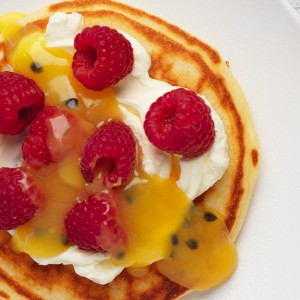 Delicious pancake recipe with mascarpone, passionfruit curd and raspberries