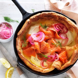 Smoked salmon Dutch Baby recipe with cream and pickled onion