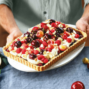 Berry fruit tart with cherries and raspberries